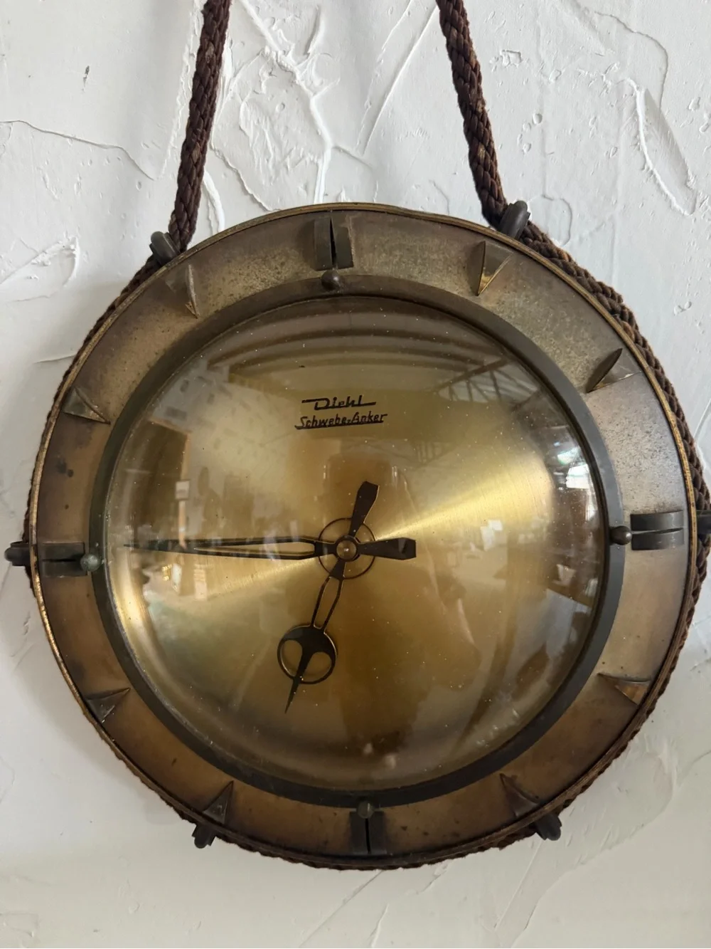vintage mid-century Diehl brass hanging wall clock featuring a distinctive braid